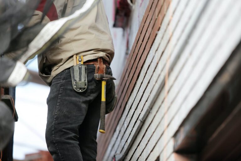 Construction worker installing interior building materials